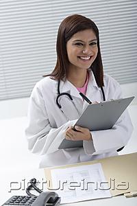PictureIndia - Doctor smiling with report in hand