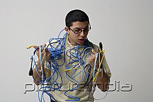 PictureIndia - Man with cords and wires around his neck
