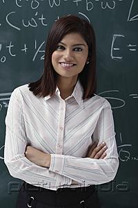 PictureIndia - Teacher leaning against chalk board