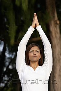 PictureIndia - woman practicing yoga outside