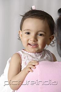 PictureIndia - young toddler smiling happily in mother's arms