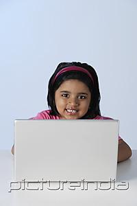 PictureIndia - Little girl at laptop computer