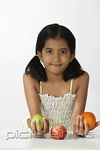PictureIndia - girl holding fruits