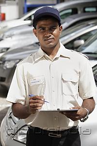 PictureIndia - Security guard holding clipboard