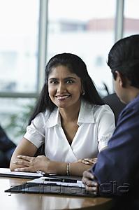 PictureIndia - Indian woman smiling during meeting