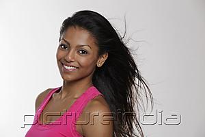 PictureIndia - Head shot of smiling woman with long hair
