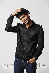 PictureIndia - young man smiling wearing a hat