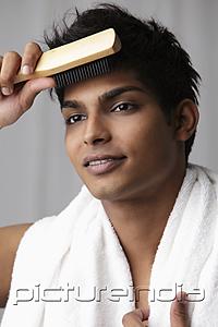PictureIndia - young man brushing his hair