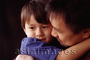 Asia Images Group - Young boy hugging his father