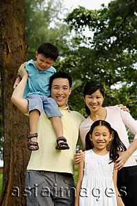 Asia Images Group - Family of four, standing outdoors, family portrait