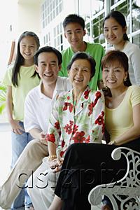 AsiaPix - Three generation family smiling at camera