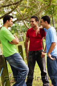 PictureIndia - Young men standing, talking
