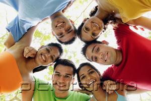 PictureIndia - Group of young adults arms around each other, smiling