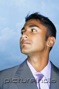 PictureIndia - Businessman looking away, head shot
