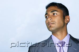 PictureIndia - Businessman looking away, portrait