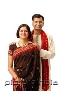 PictureIndia - Indian couple in traditional clothing, looking at camera