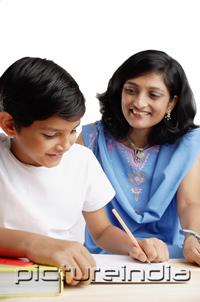 PictureIndia - Mother watching son do homework