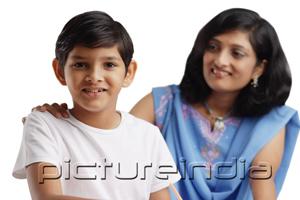 PictureIndia - Boy looking at camera, mother behind him with her hand on his shoulder