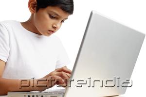 PictureIndia - Boy using laptop