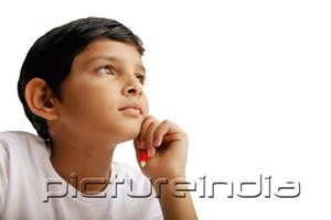 PictureIndia - Boy with hand on chin, portrait