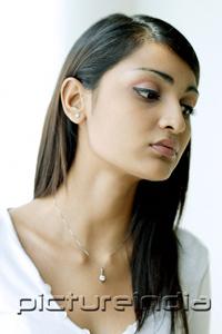 PictureIndia - Young woman with long hair, looking away