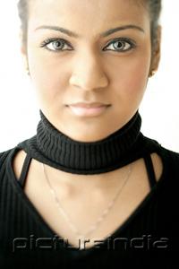 PictureIndia - Young woman dressed in black, looking at camera