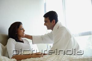 PictureIndia - Couple in bedroom, looking at each other