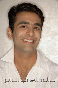 PictureIndia - Man smiling, portrait