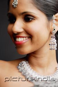 PictureIndia - Head shot of woman with Indian jewellery