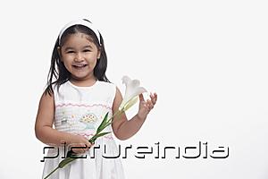 PictureIndia - Young girl in white dress, holding a flower