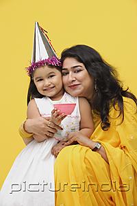 PictureIndia - Mother embracing young daughter