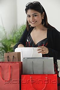 PictureIndia - Woman surrounded by shopping bags